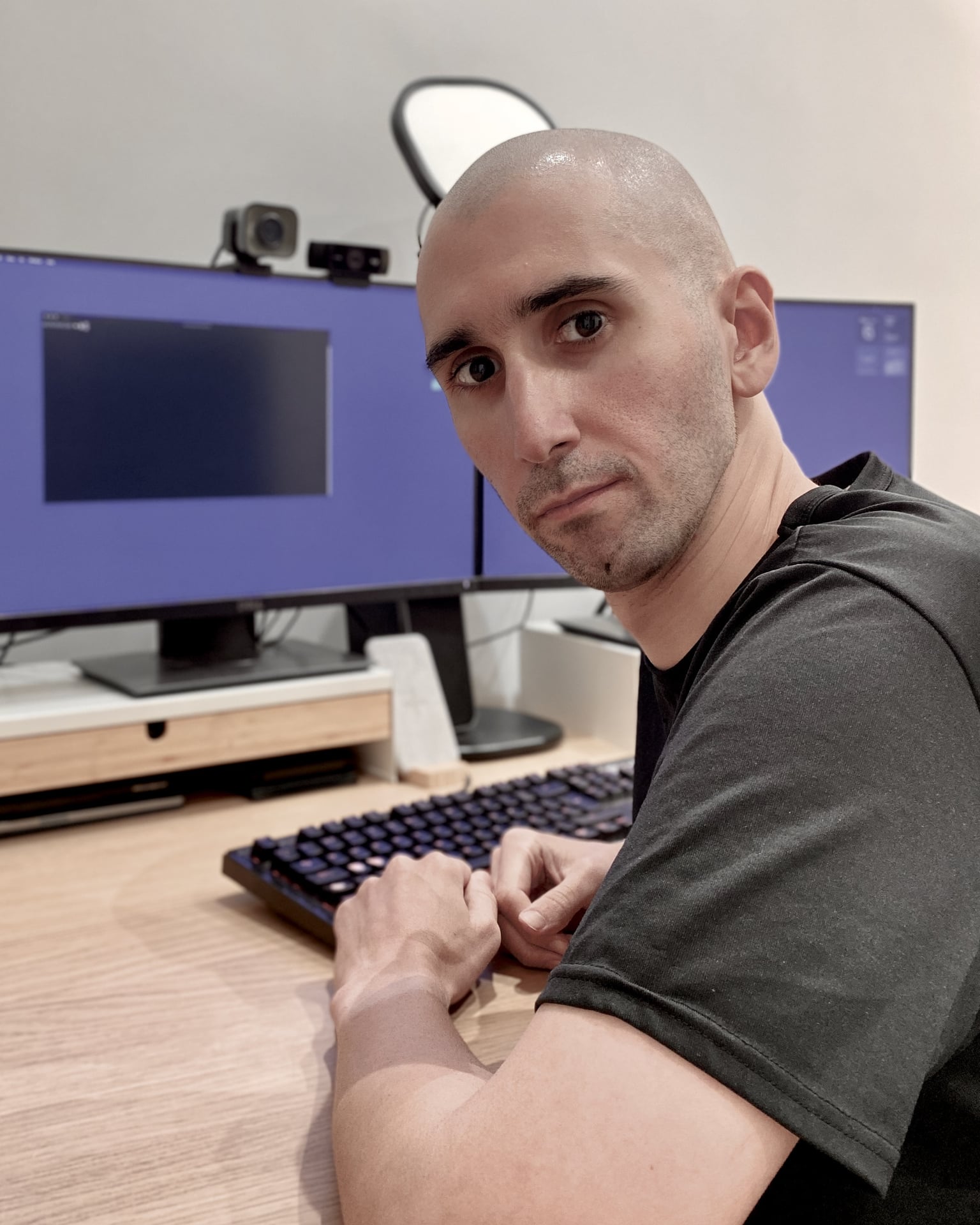 A portrait of Dani on his computer